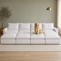 4 Seat SkyLux Nest Cloud Couch in White — four seats each with its own ottoman forming a continuous platform, golden retriever sitting on the platform