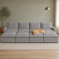 4 Seat SkyLux Nest Cloud Couch in Light Grey — four seats each with its own ottoman forming a continuous platform, golden retriever lying on the platform