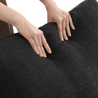 SkyLux Extra Cover Set in Black — close-up of the boucle weave as hands press into the cushion