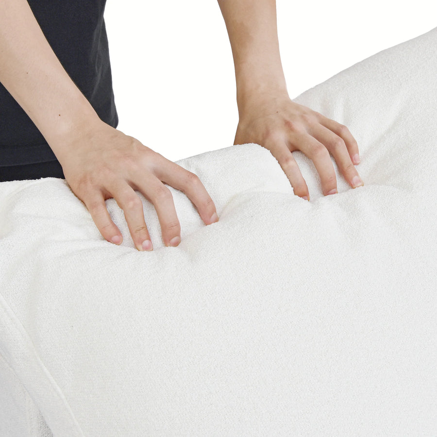 SkyLux Extra Cover Set in White — close-up of the boucle weave as hands press into the cushion